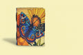 Colorful butterfly design on a notebook with a sunflower background