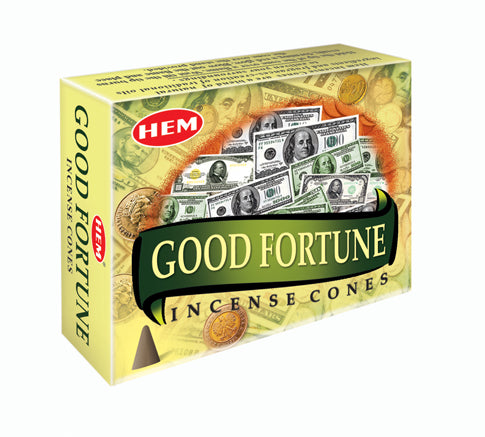 Box of HEM Good Fortune Incense Cones with dollar bills and coins on a white background