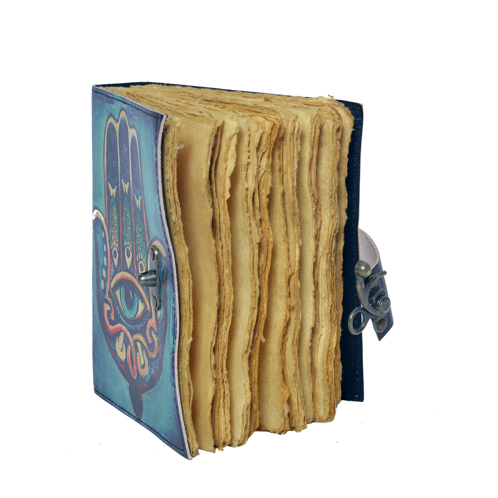 Small book with colorful cover and textured pages on a white background