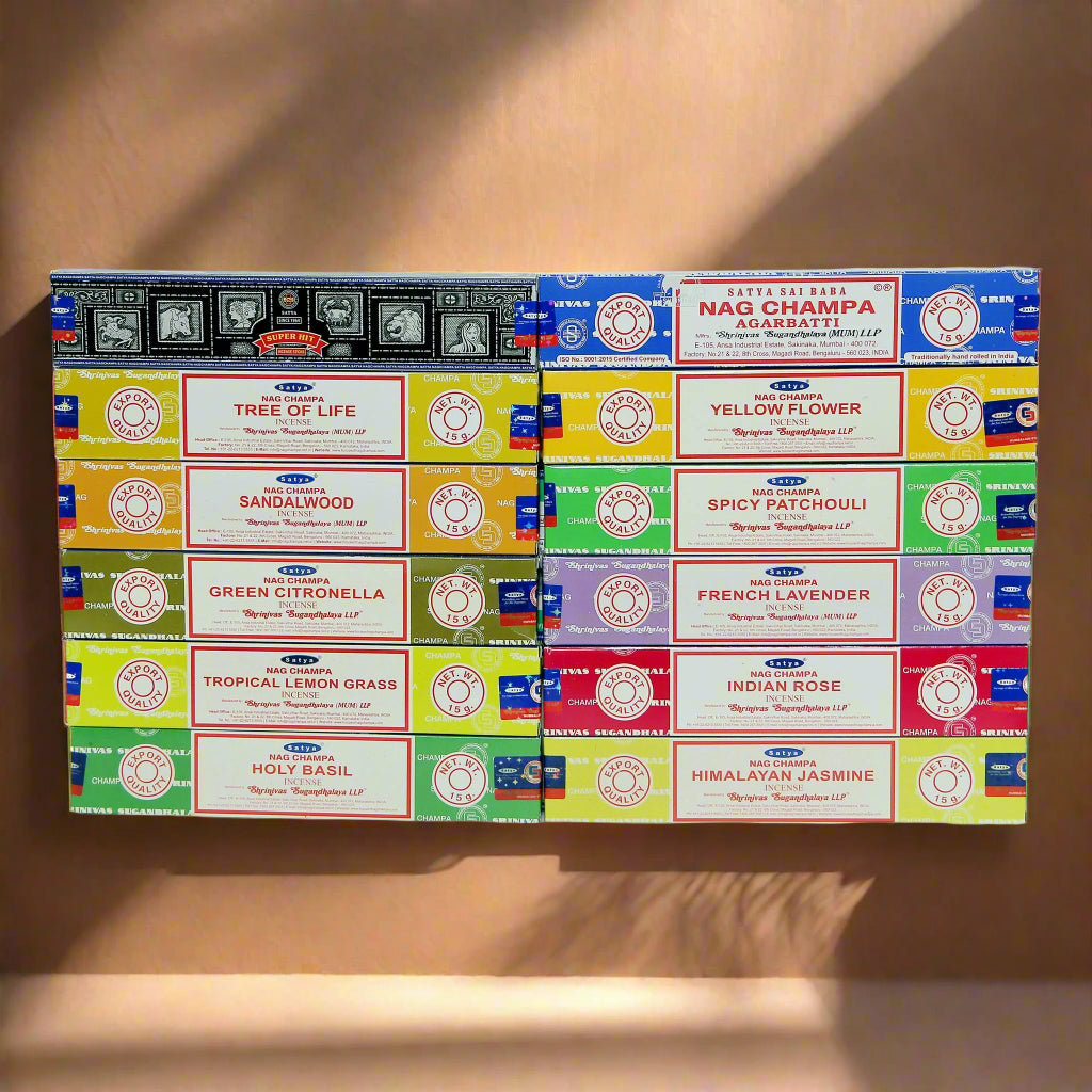 A collection of Satya incense boxes in various fragrances, displayed in an organized manner.