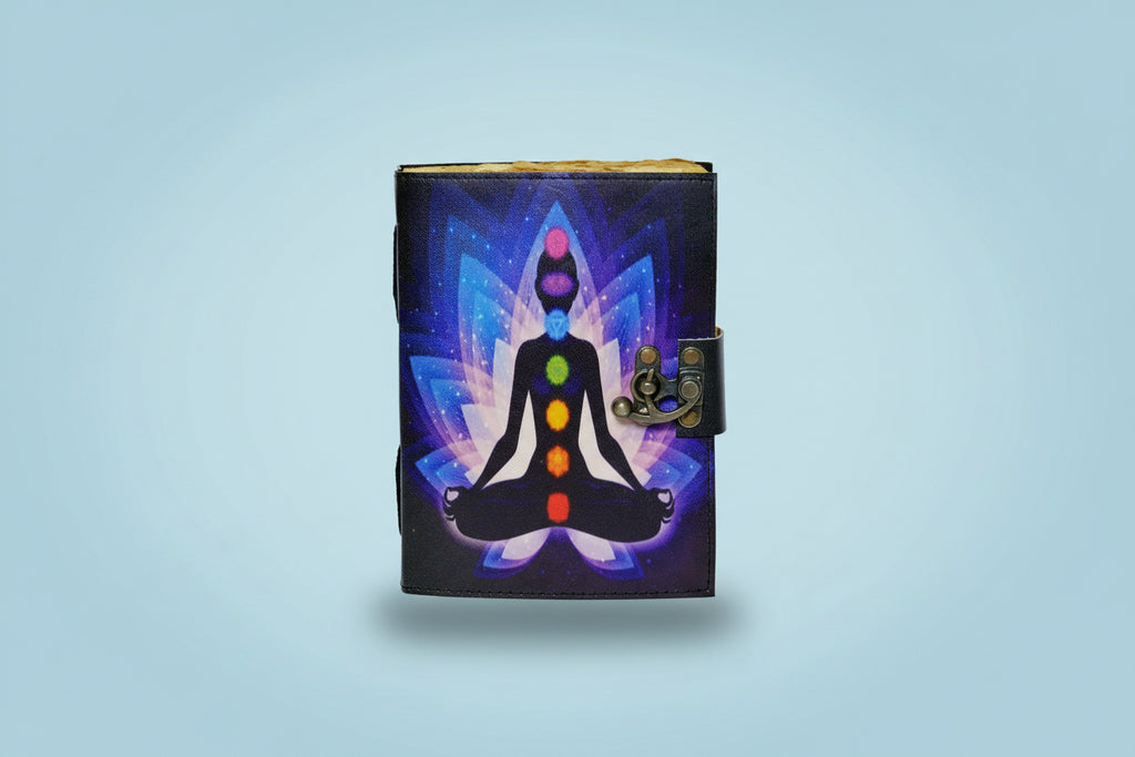 Journal with a chakra design on a black cover against a white background