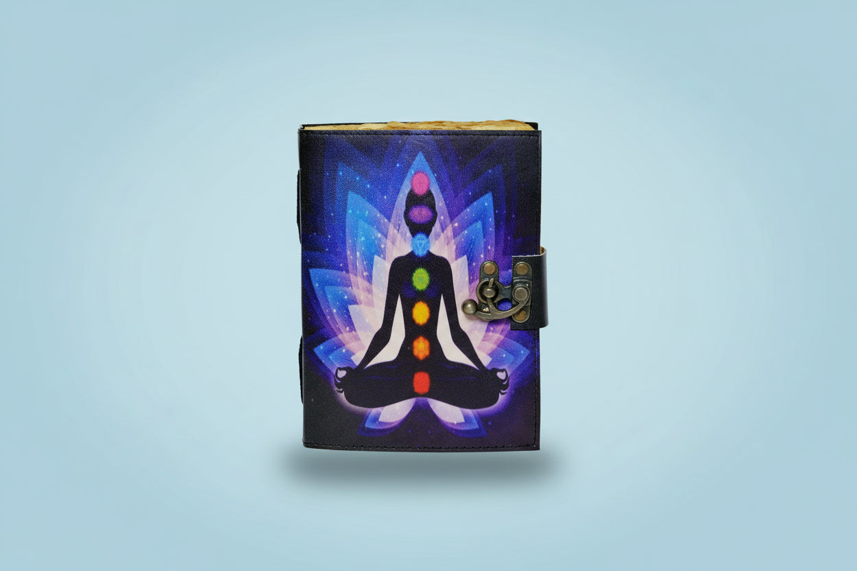 Journal with a chakra design on a black cover against a white background