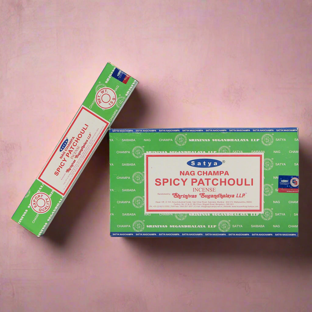 A collection of Satya incense boxes in various fragrances, displayed in an organized manner.
